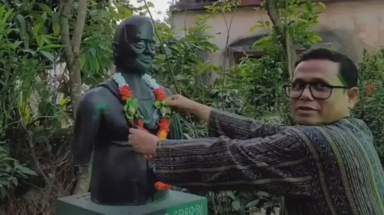 Doctor Sarangi Garlanding His Gardener's Statue