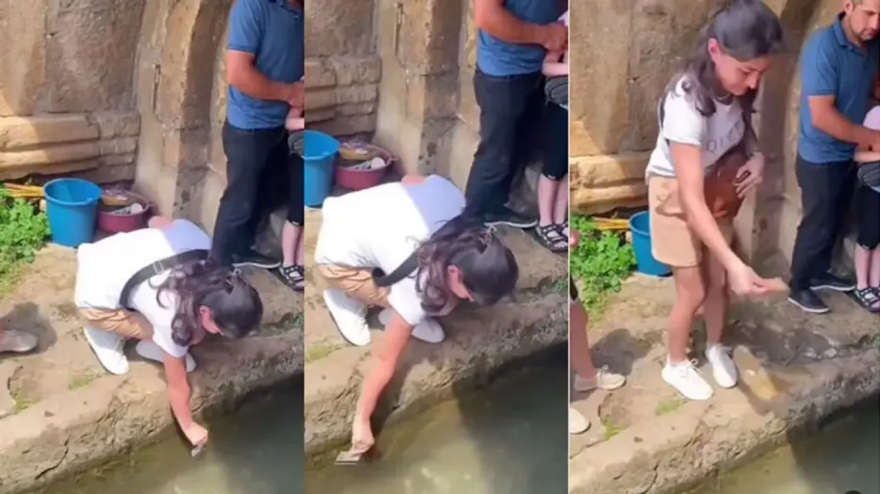 Girl swipes ATM card on water body for cash offering, watch