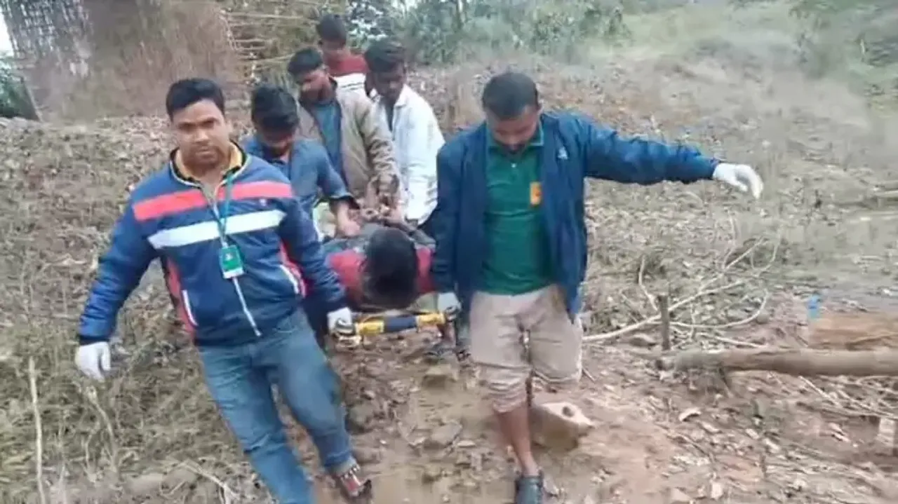 Injured Man Carried On Stretcher To Ambulance