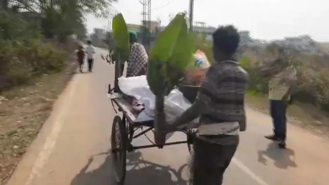 Elderly Woman's Body Carried On Trolley