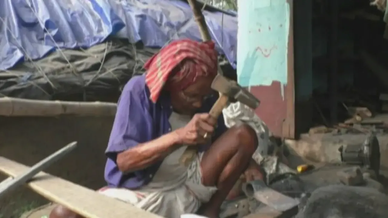 105-Year-Old Blacksmith Working At His Workshop