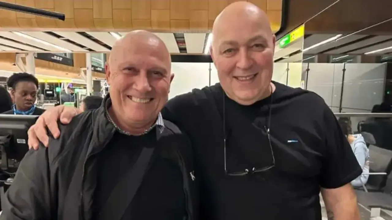 Doppelgangers sit next to each other on flight