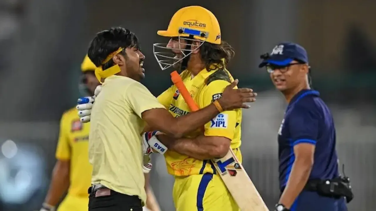 MS Dhoni with a pitch invader in Ahmedabad 