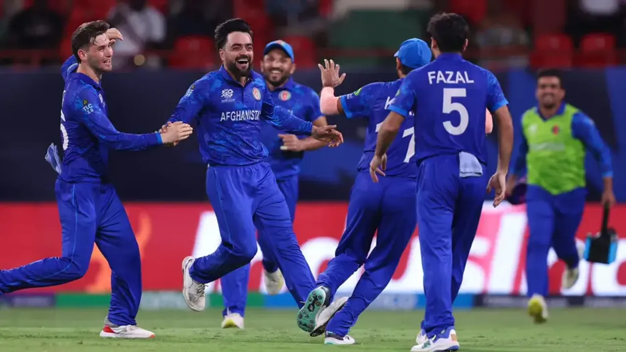 Afghanistan players celebrate the fall of an Australian wicket