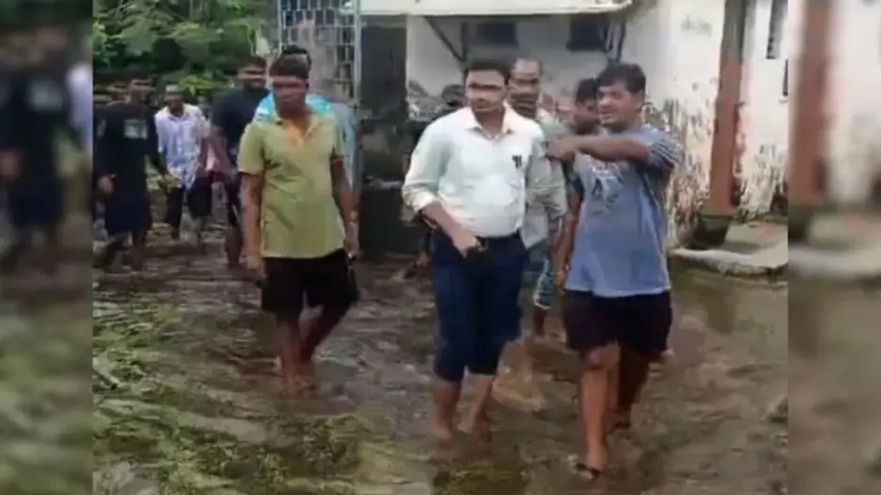 BEO wades through drain water