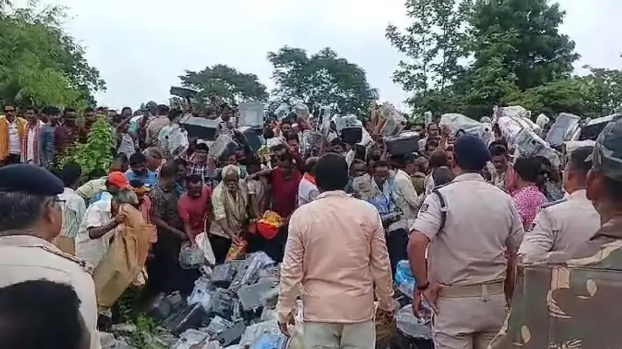 Protesting farmer dump electricity meters outside Tata Power office in Bargarh