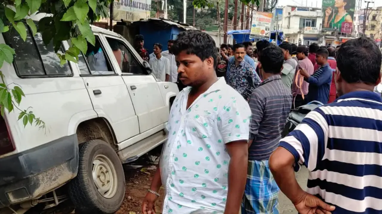 Police van falls into drain after hitting two persons