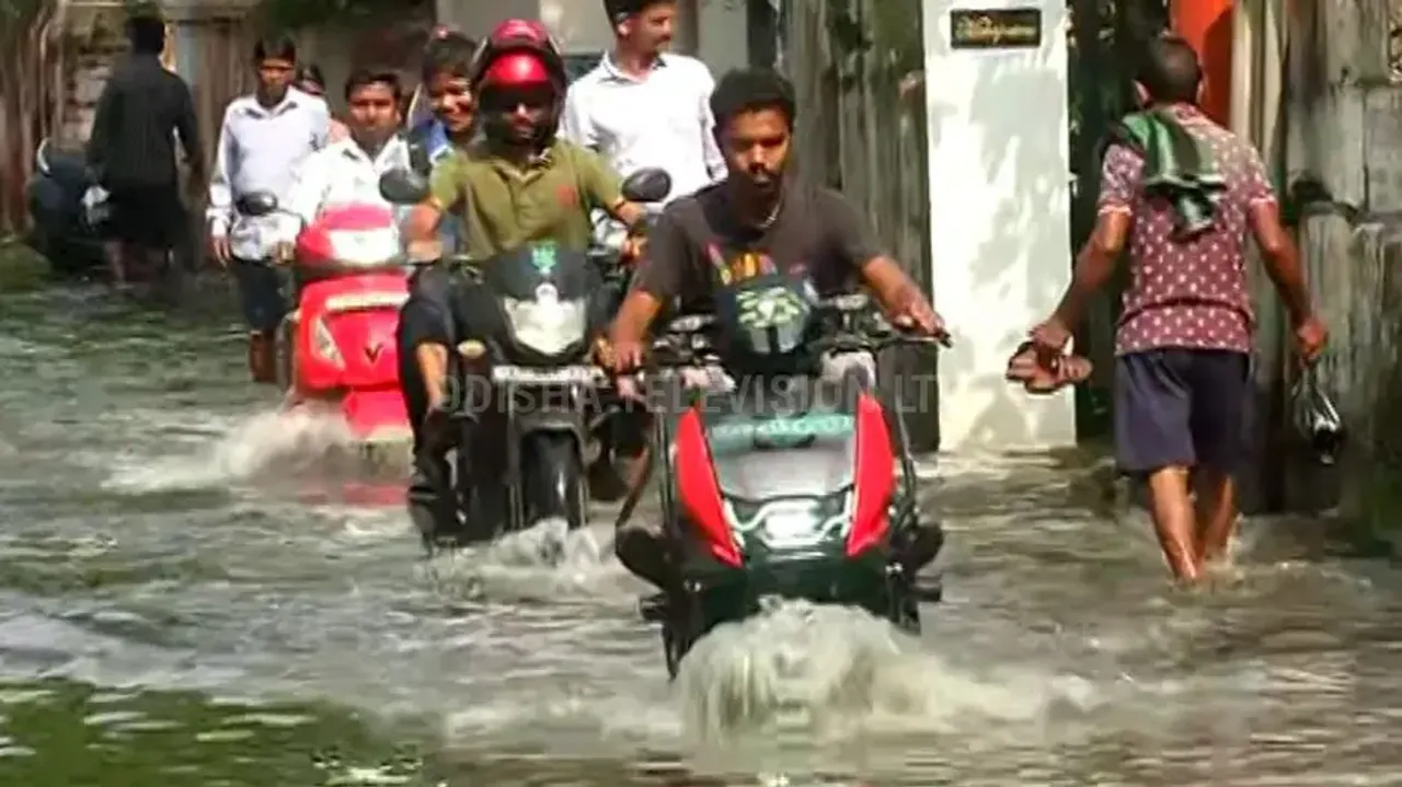 Cuttack residents wade through knee-deep water as nor’wester rain causes waterlogging