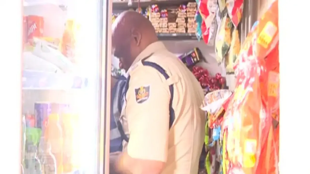 Masala shop banner in front, ganja trade inside