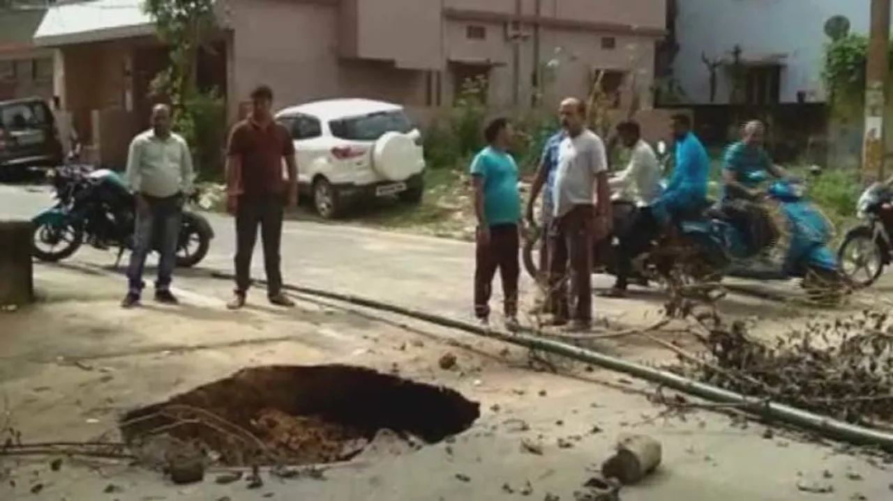 Road caves in again in twin city