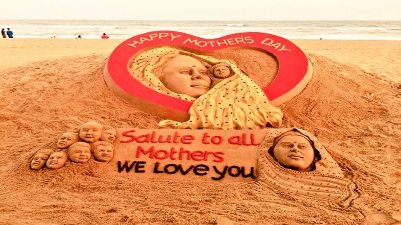 Sand artist Sudarshan Pattnaik creates sand art on Mothers' Day at Puri beach