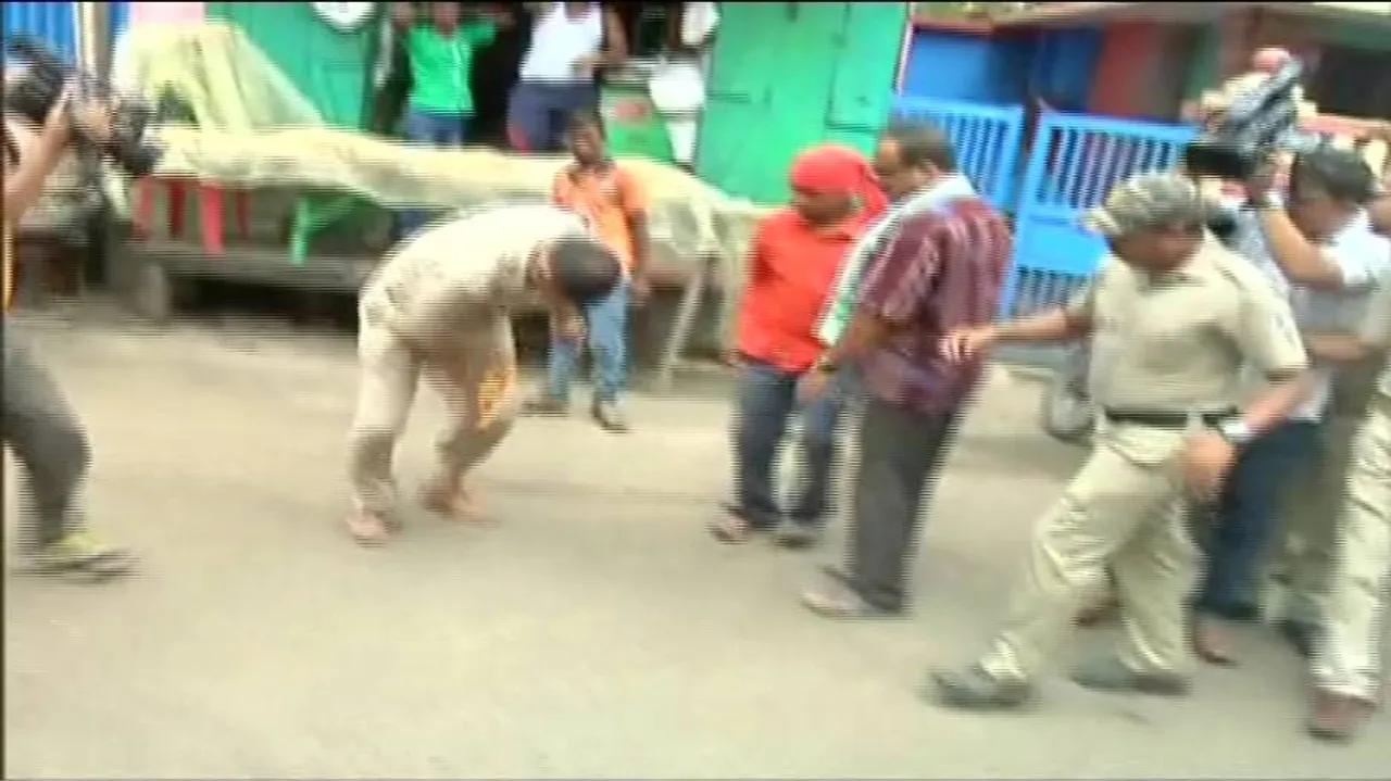 Cop’s uniform catches fire during a rally over Swargadwar land grab