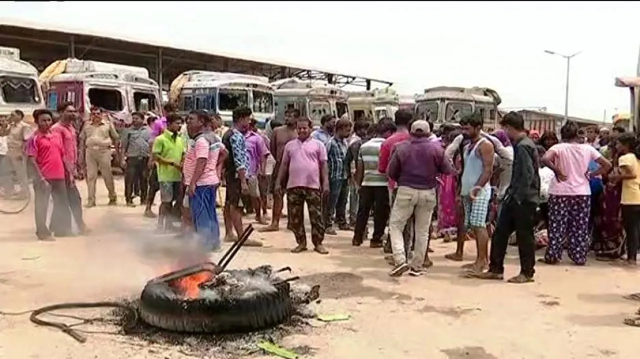 Mob ransacks 70 trucks following death of elderly woman