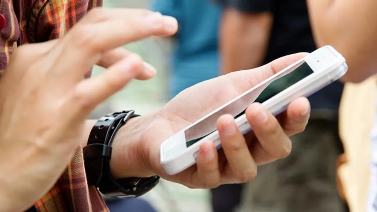 person using white phone t