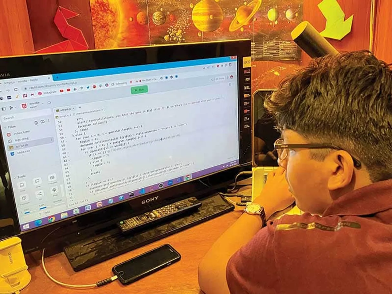 Saion working on his laptop