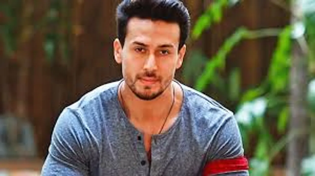 Tiger Shroff stays suave and cool amidst danger in the newest Heropanti 2 poster!