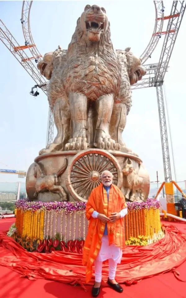 PM Modi Unveils National Emblem Statue Atop Parliament