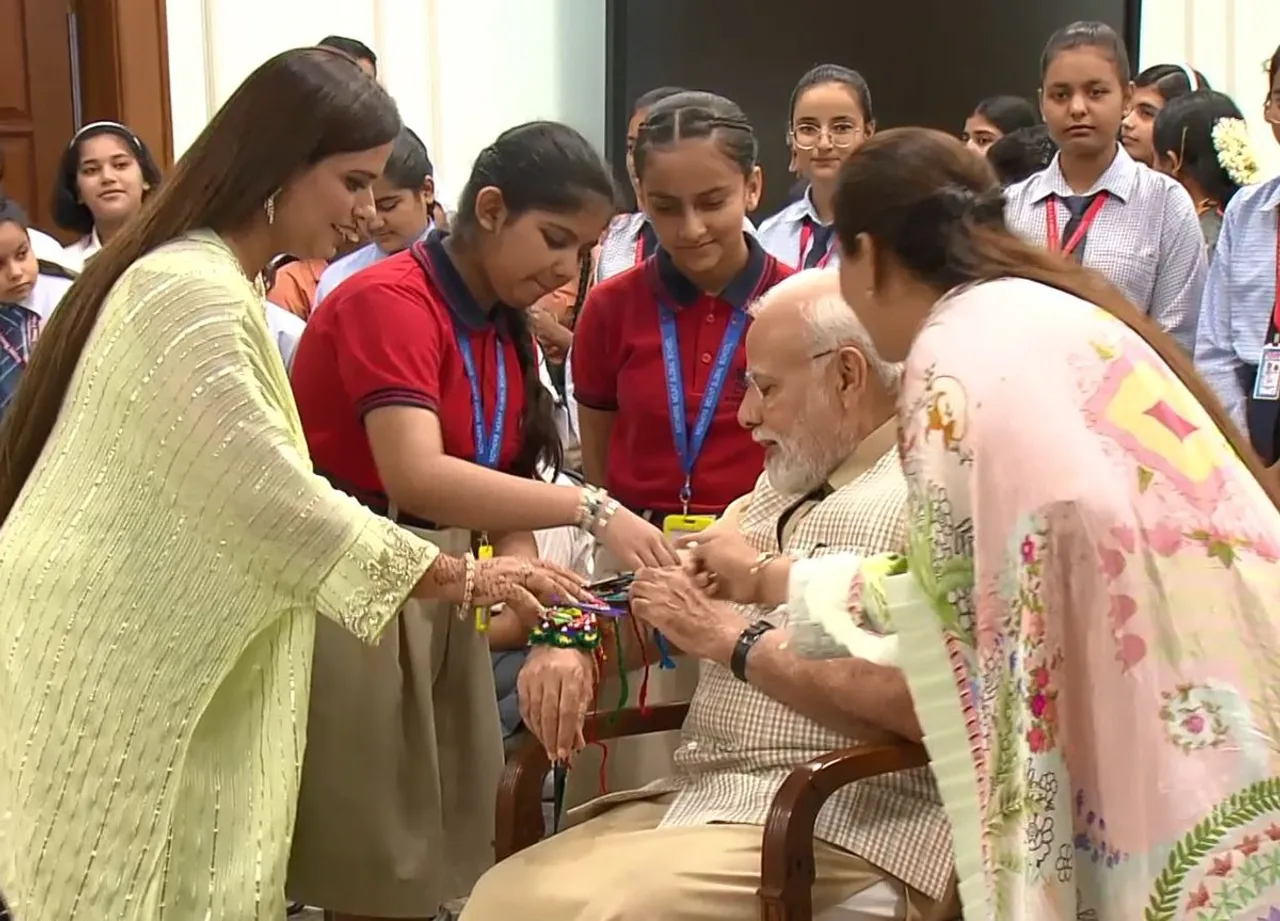 IN PICS: School Girls Tie Rakhi To PM Modi On Raksha Bandhan