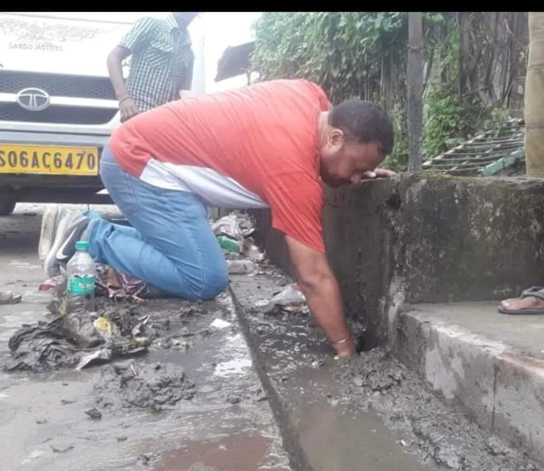 Tingkhong MLA picks up garbage, cleans drains