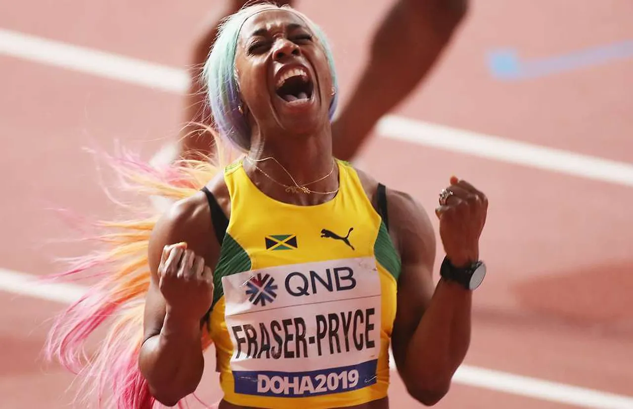 Shelly-Ann Fraser-Pryce collecting her fourth world 100m title in Doha