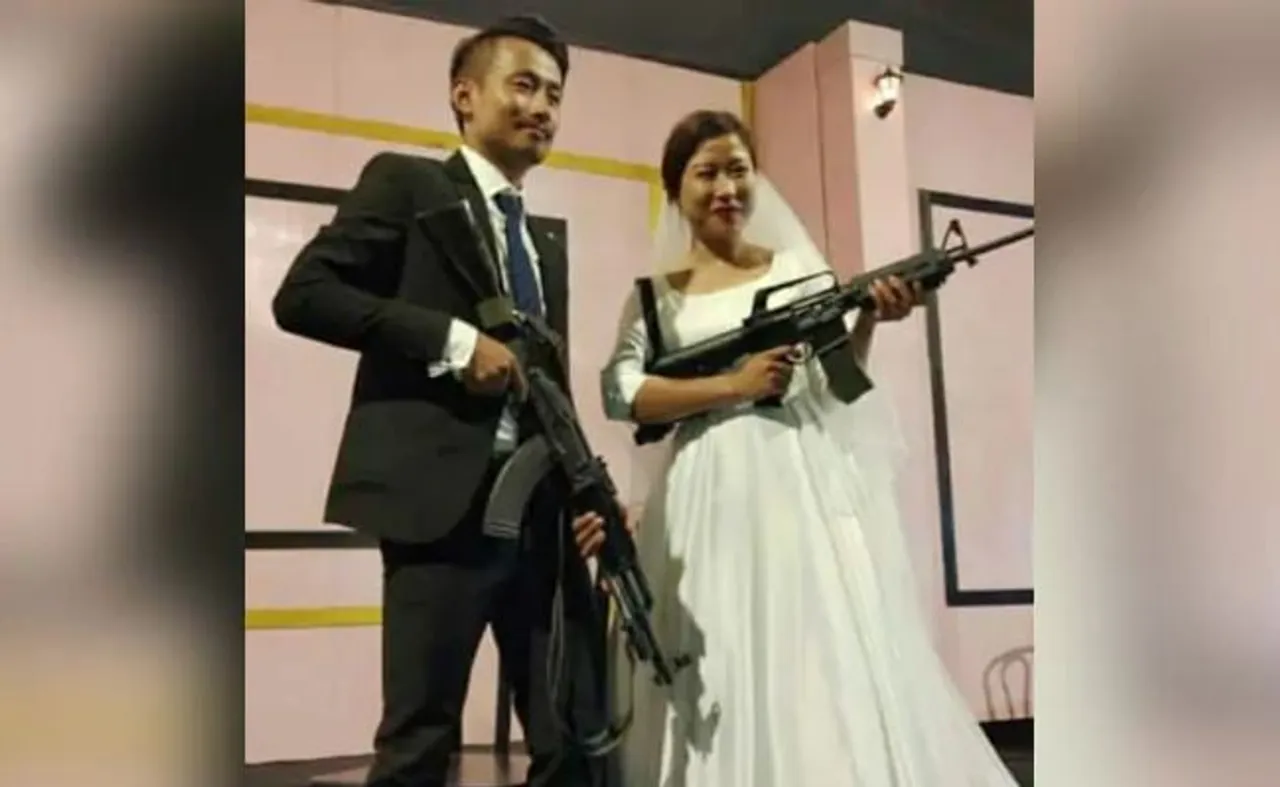 Wedding pics: Bride, groom pose with assault rifles