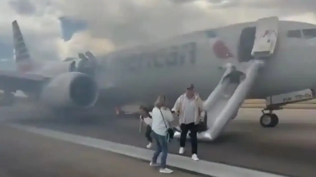 American Airlines plane at Denver Airport was rapidly evacuated after one of its wheels caught fire