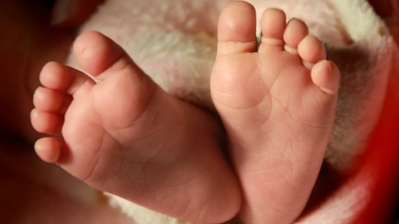 Woman puts baby in fridge