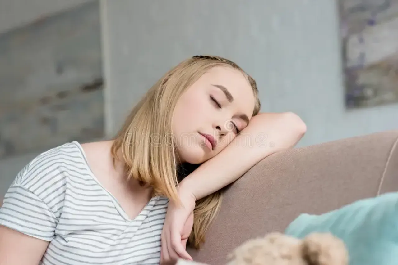 close-up-portrait-teen-girl-sleeping-sitting-couch-127759109