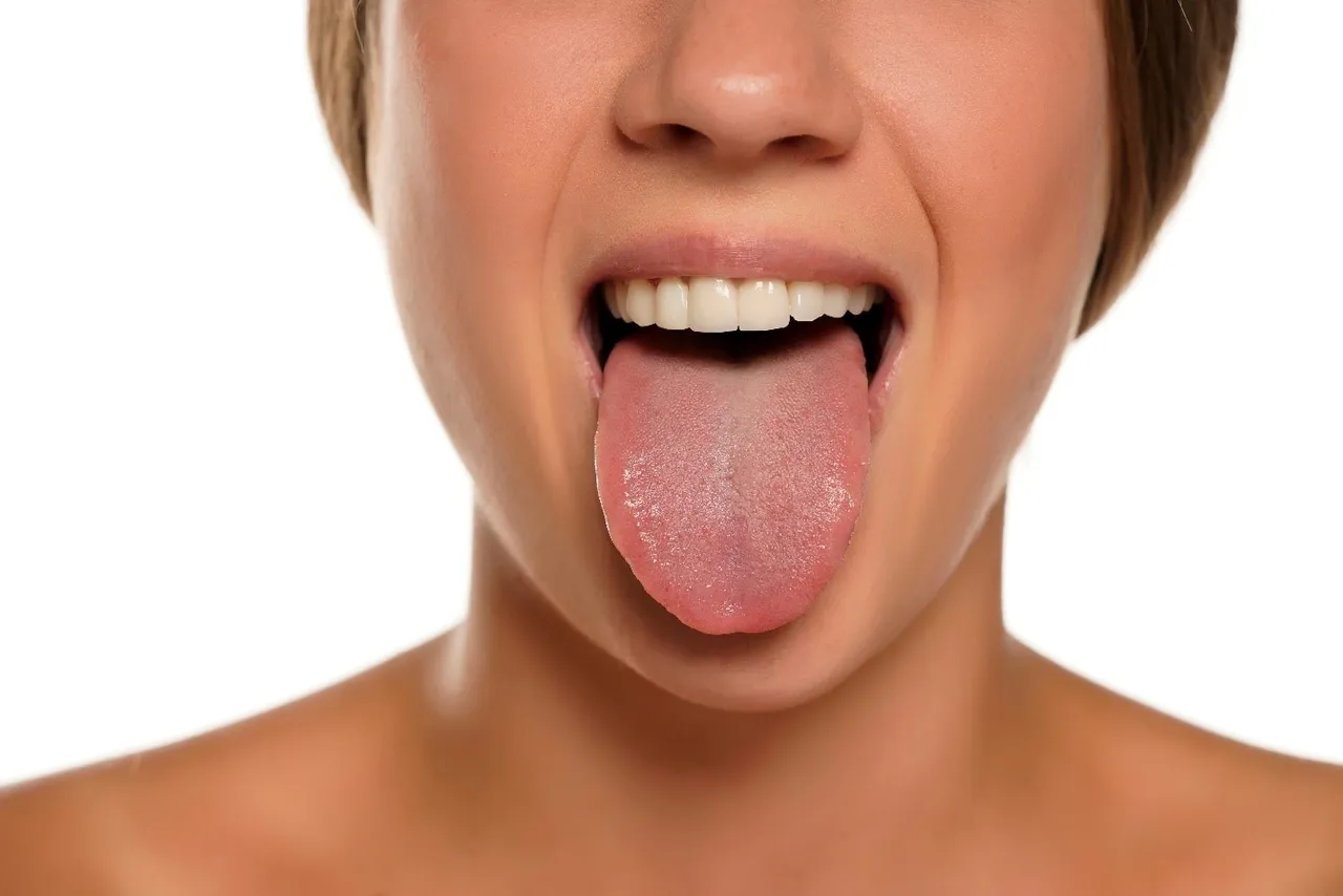 Womans-healthy-tongue-after-visit-to-dentist-in-Abington