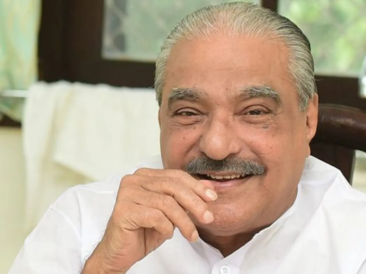 k m mani