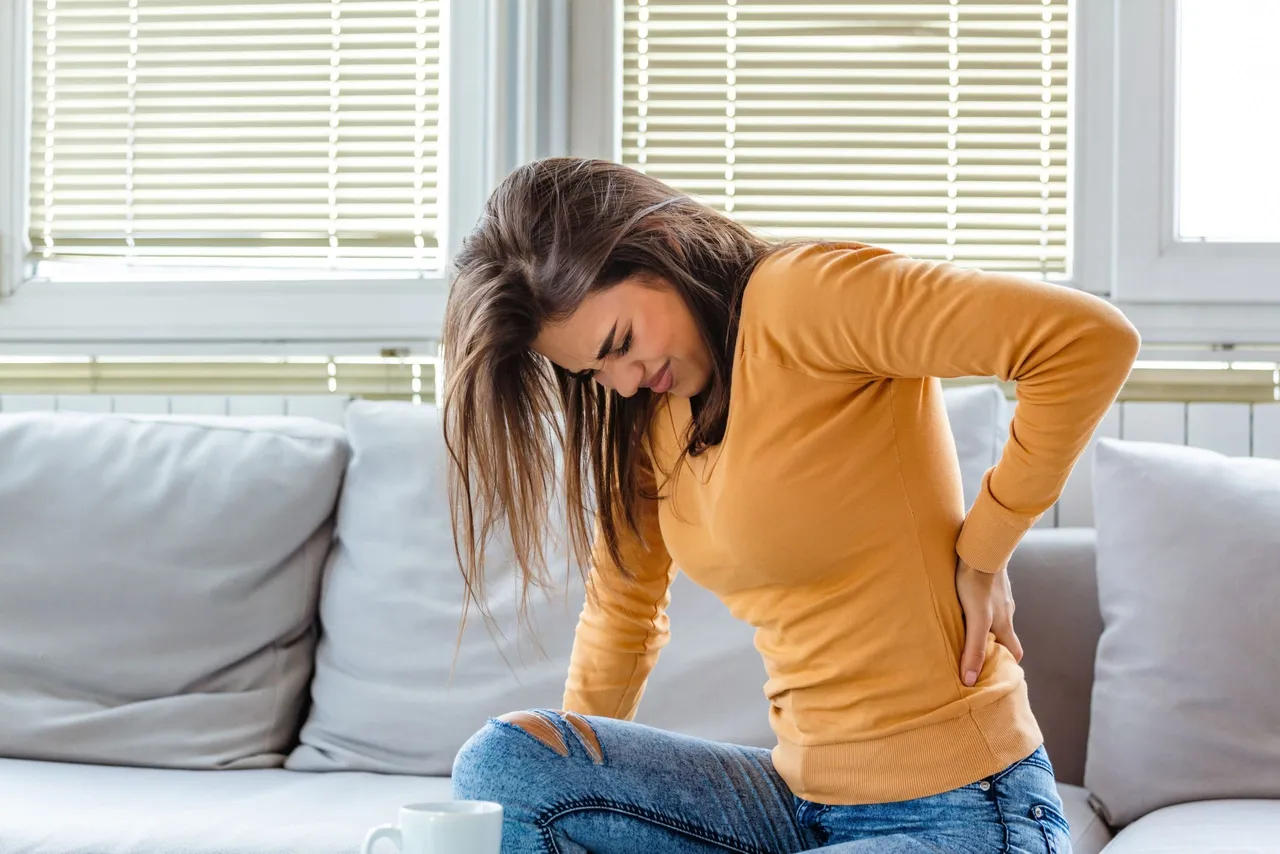 Canva-Back-Pain.-Closeup-Of-young-woman-Having-Spinal-Or-Kidney-Pain-Backache.-Girl-Suffering-From-Painful-Feeling-Muscle-Or-Nerve-Pain-Holding-Hands-On-Body.-Health-Issue-Concept.-min-scaled