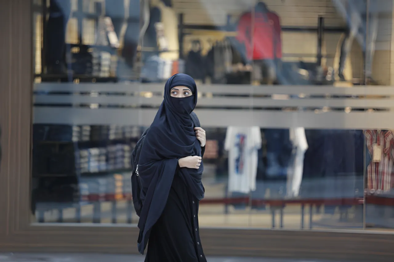 women reclaiming public spaces women in public female gaze lipstick under my burkha
