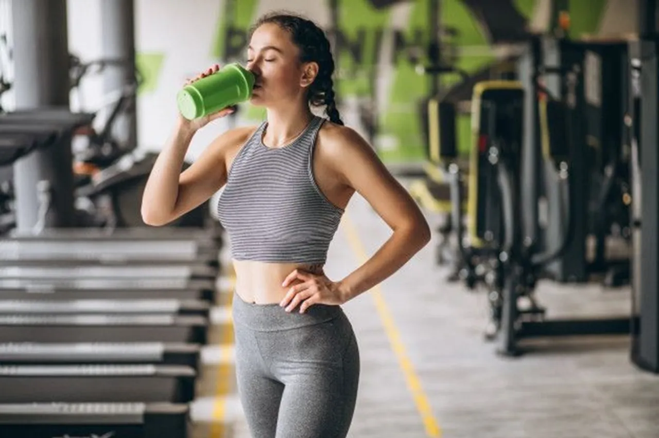 women drinking protein