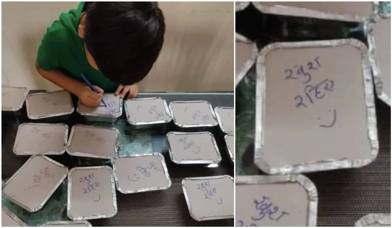 boy writes happy messages on covid meals