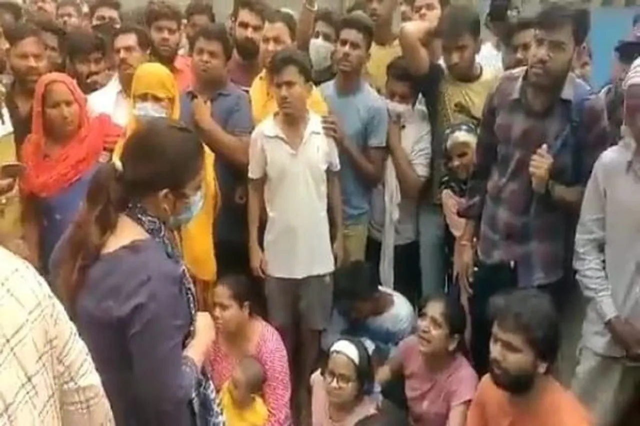 official shouts at grieving mother