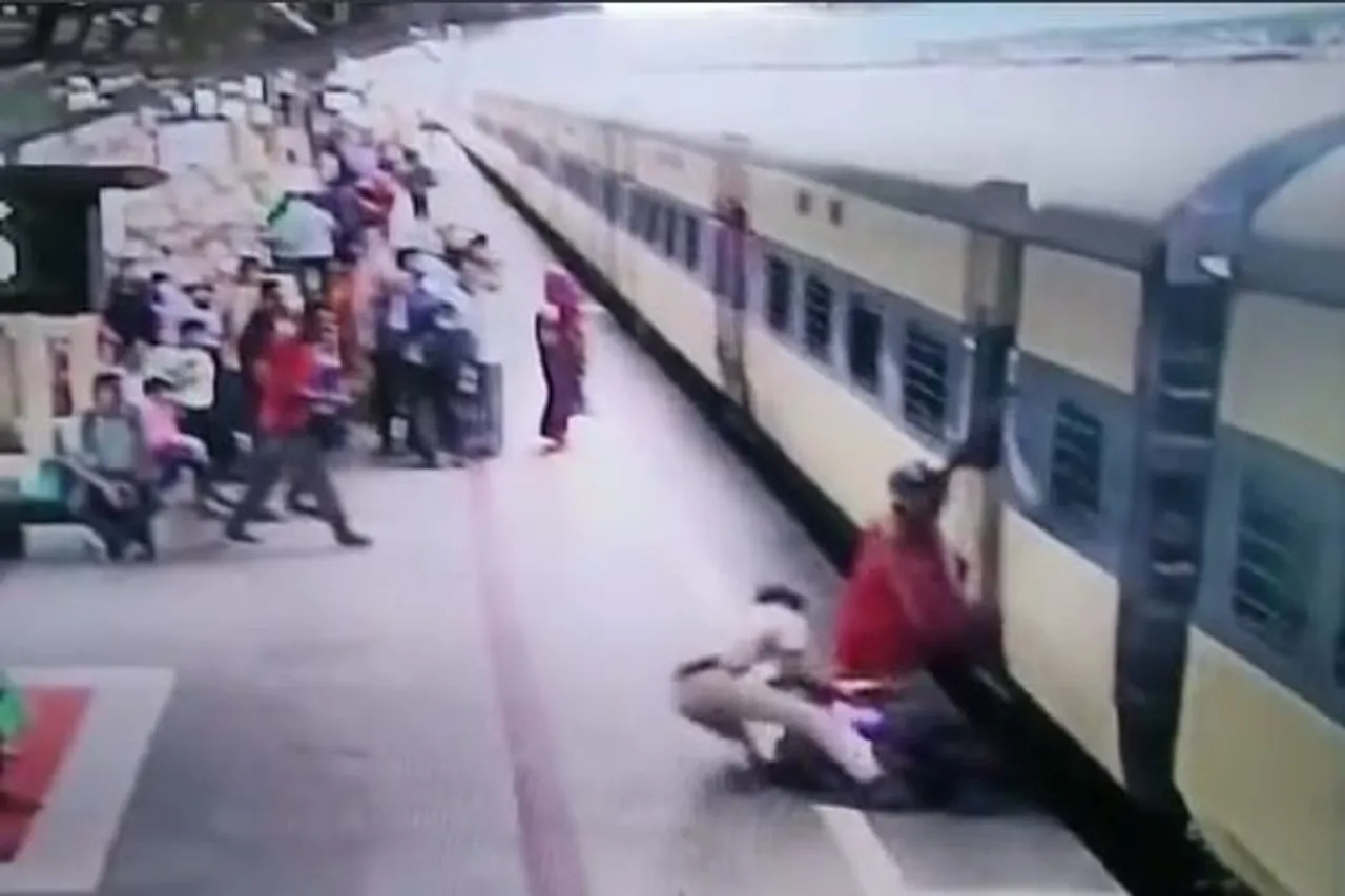 railway cop drags woman from gap