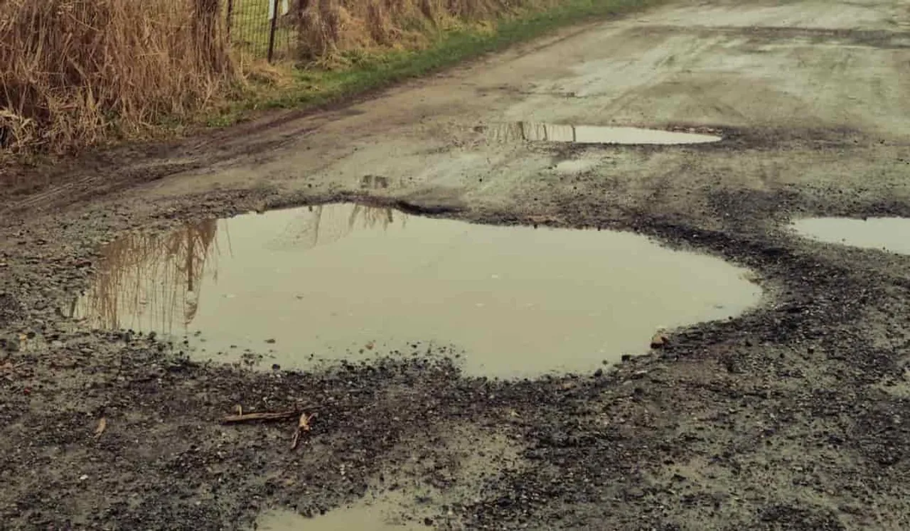 Teenager Repairs Pothole