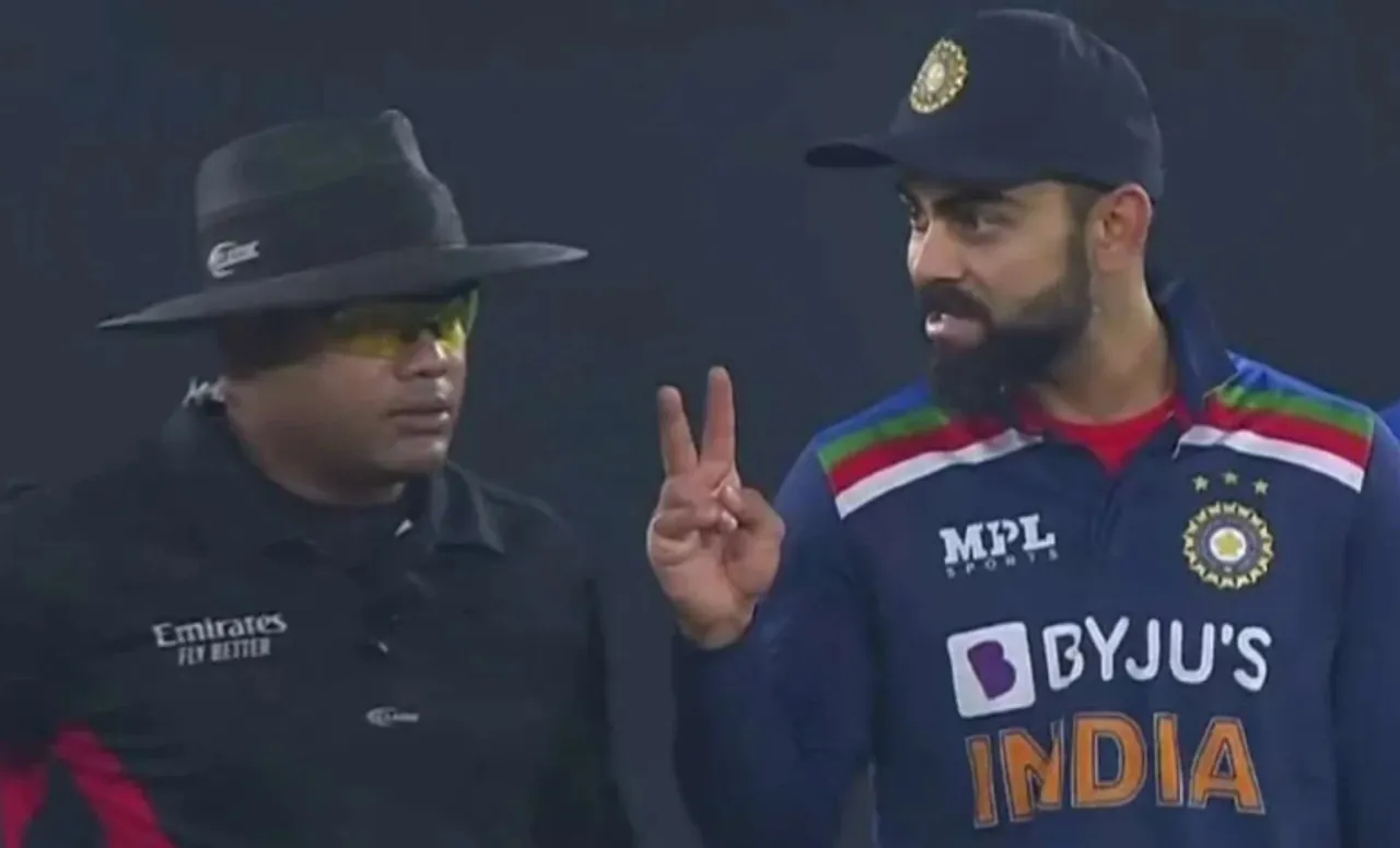 Nitin Menon with Virat Kohli