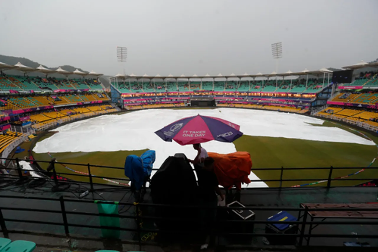 Guwahati: Covers placed on the pitch as it rains before the ICC Men's Cricket World Cup 2023