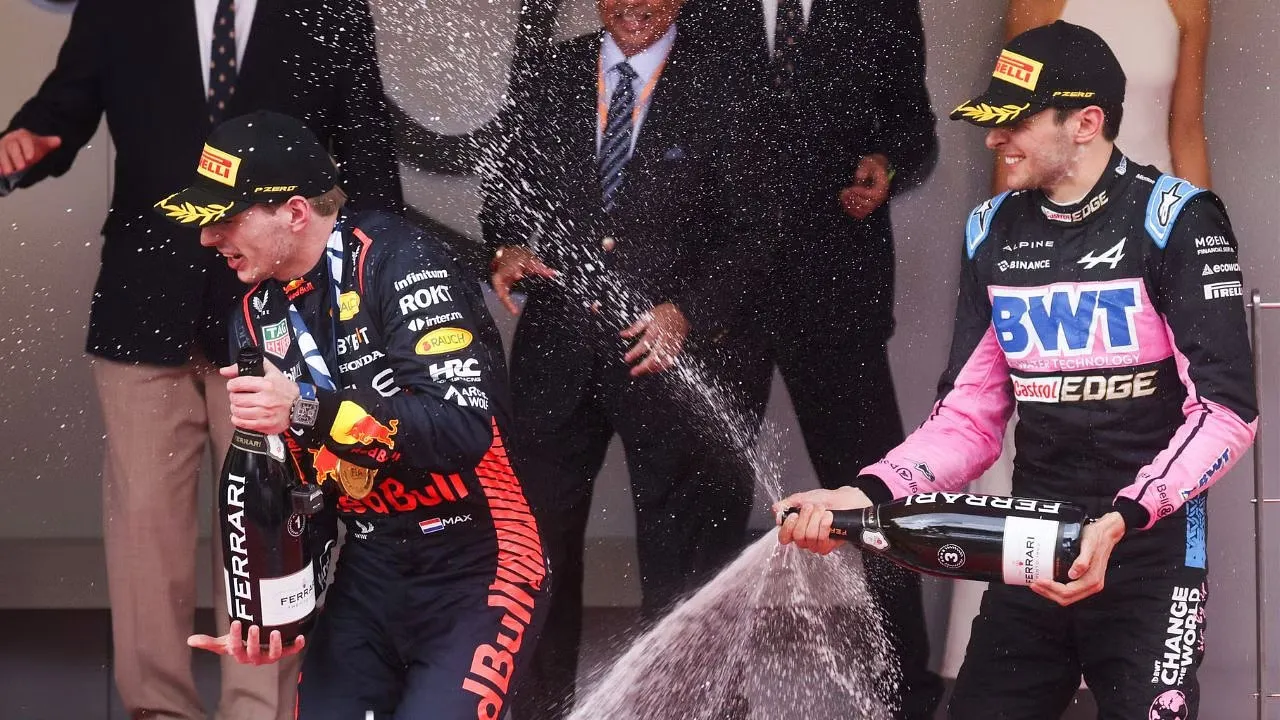 Esteban Ocon with Max Verstappen