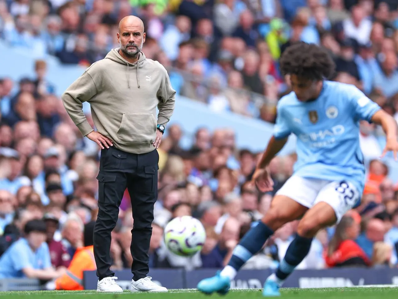 Pep Guardiola with Rico Lewis