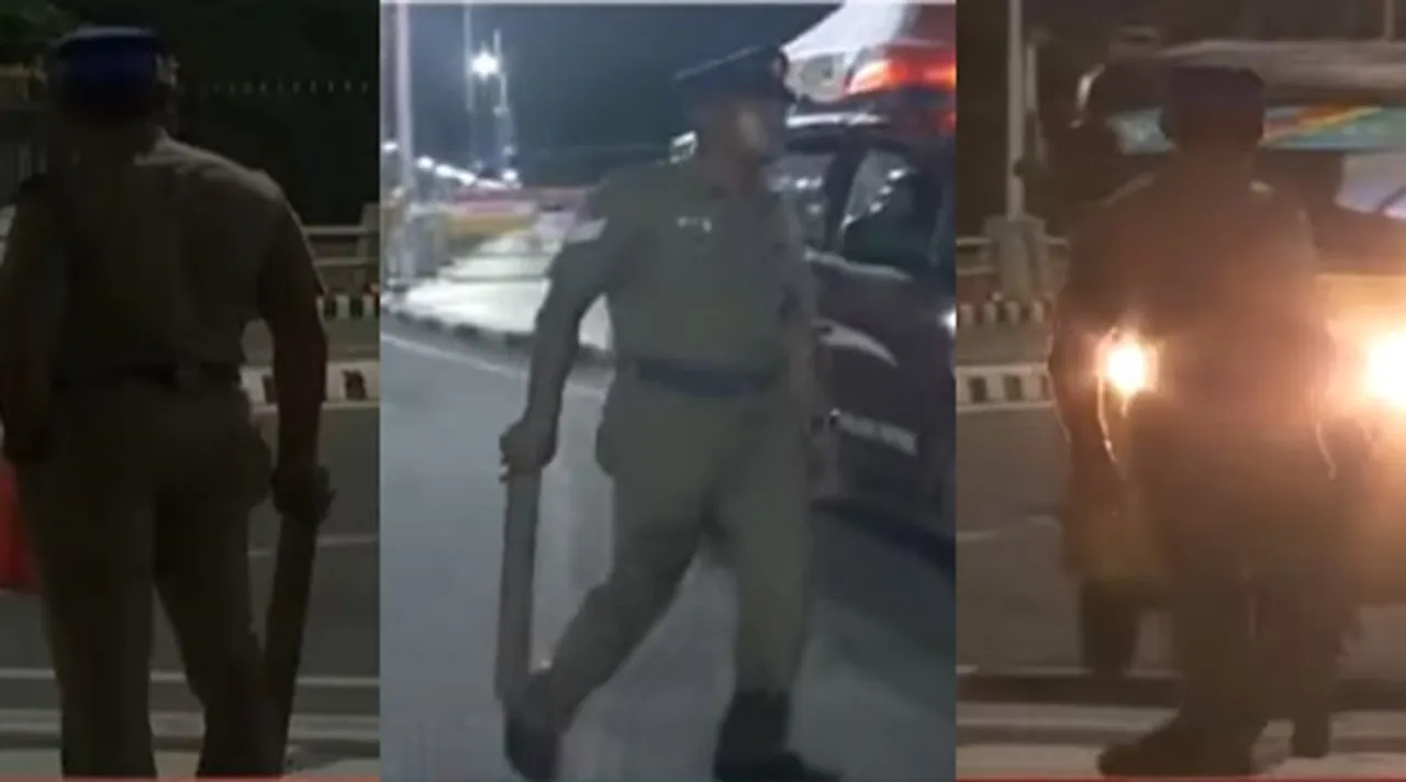 ஓஹோ! இது தான் பாதுகாப்பு பணியா சார்? உருட்டுக் கட்டையுடன் ”ட்யூட்டியில்” காவலர்!