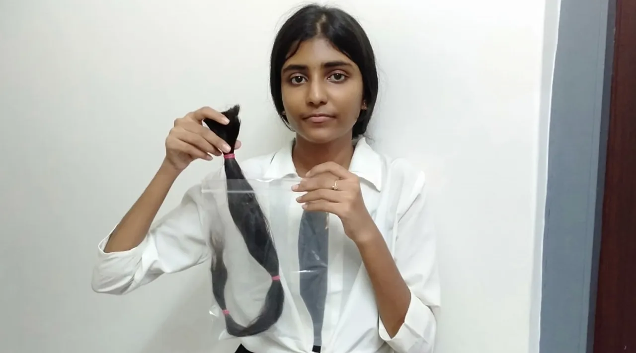 புற்றுநோயாளிகளுக்கு தலை முடியை தானம் செய்த சட்டக் கல்லூரி மாணவி