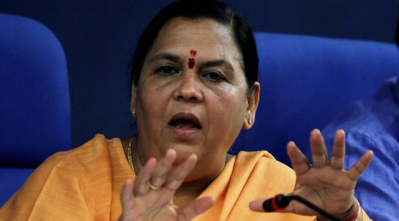 Uma Bharti ties cows front of liquor shop in Madhya Pradesh Tamil News