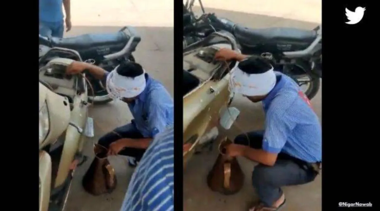 Social media viral, Petrol pump worker drains out petrol from scooter, ரூ. 2000 நோட்டை வாங்க மறுத்து... ஸ்கூட்டரில் திரும்ப பெட்ரோல் எடுத்த பங்க் ஊழியர்: வீடியோ