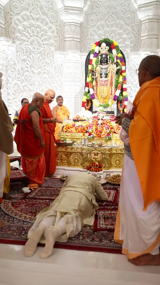 Prime Minister Modi performs Dandvat Pranaman, a reverential bow, before the divine idol of Lord Ram during the sacred ceremony.