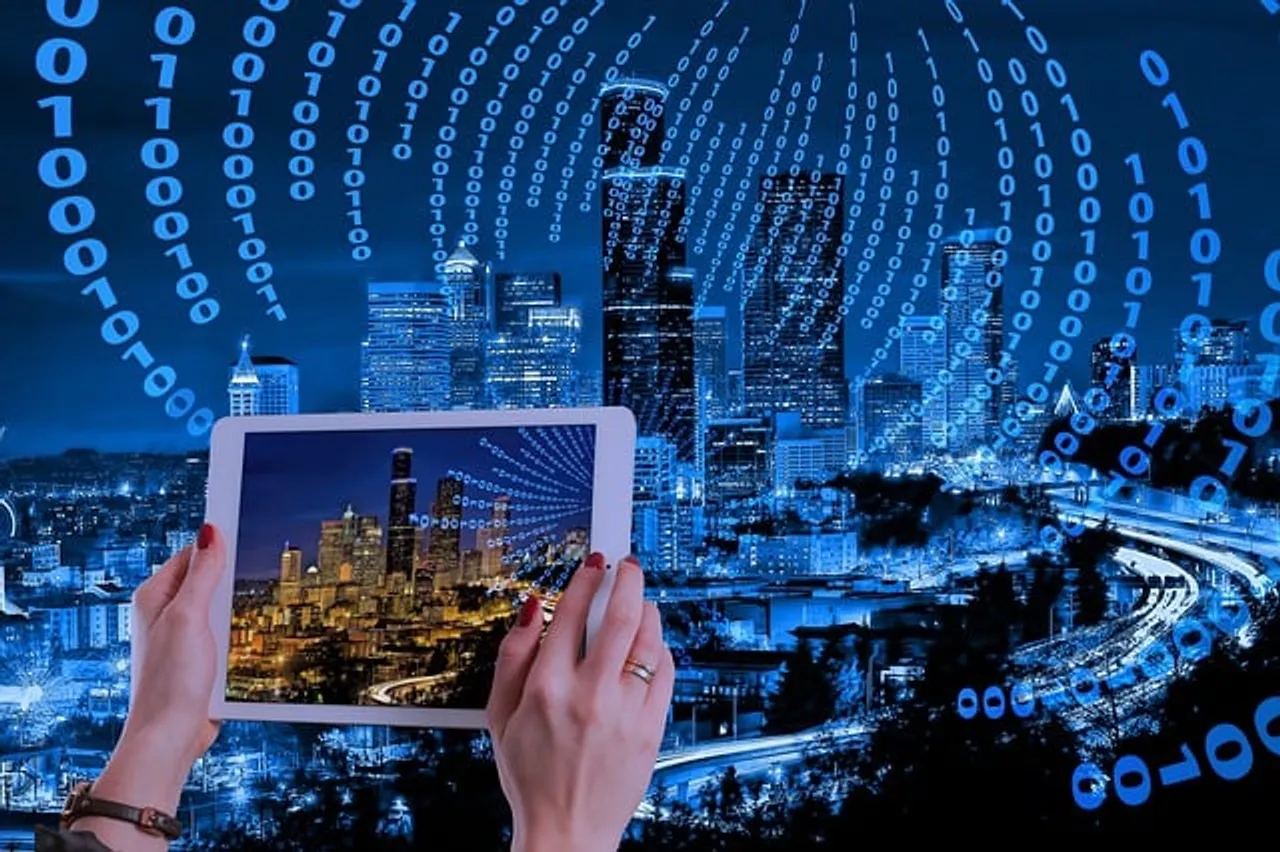 Tablet showing city skyline and code