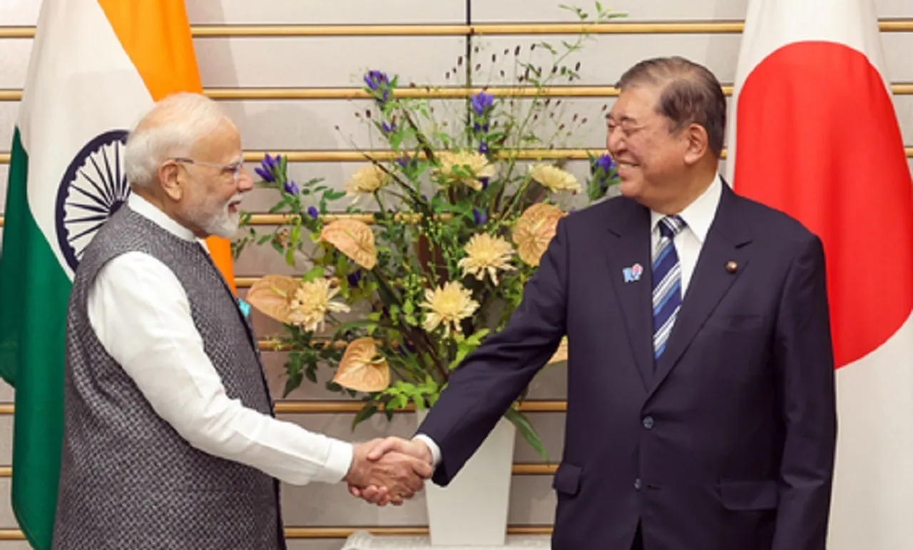 Narendra Modi shakes hands with  Shigeru Ishiba