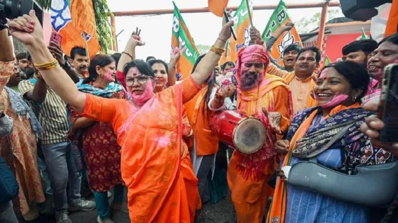 BJP supporters celebrate at the party office in Patna