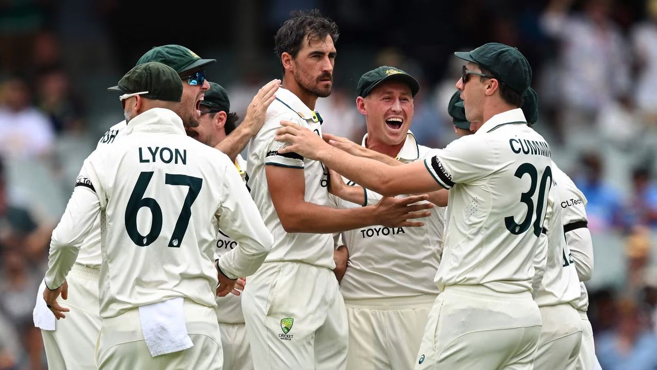 Australian players wear black armbands in memory of Hughes and Redpath 1